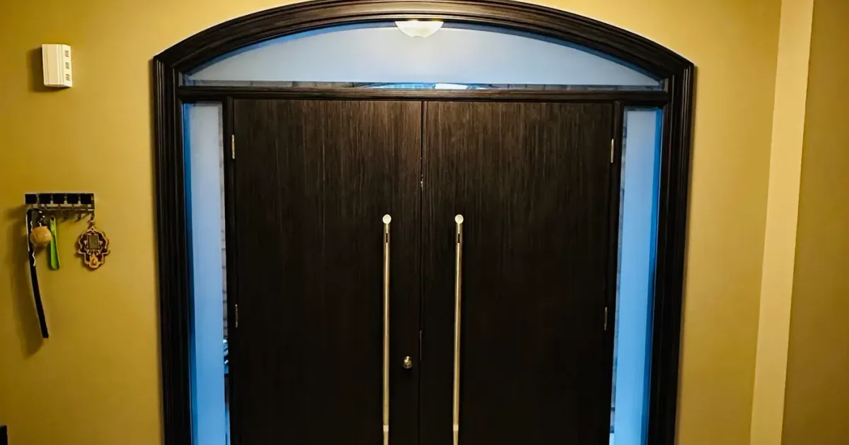 Front entry door on a home in Barrie, Ontario — winter latch adjustment