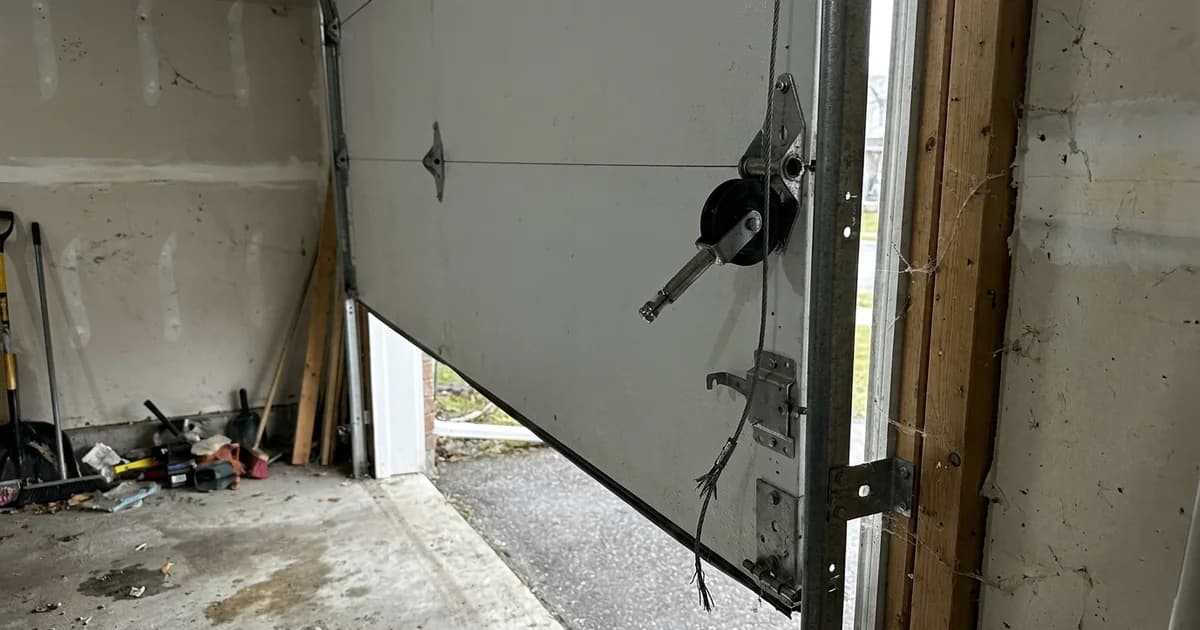 Interior garage view of a roller off the track in Barrie, Ontario